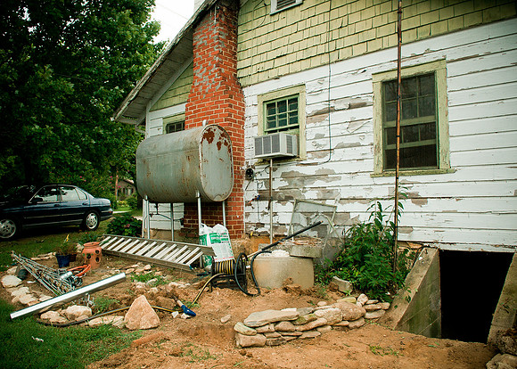 garden before, i built a retaining wall here, the oil container is gone, and now we have flowers!